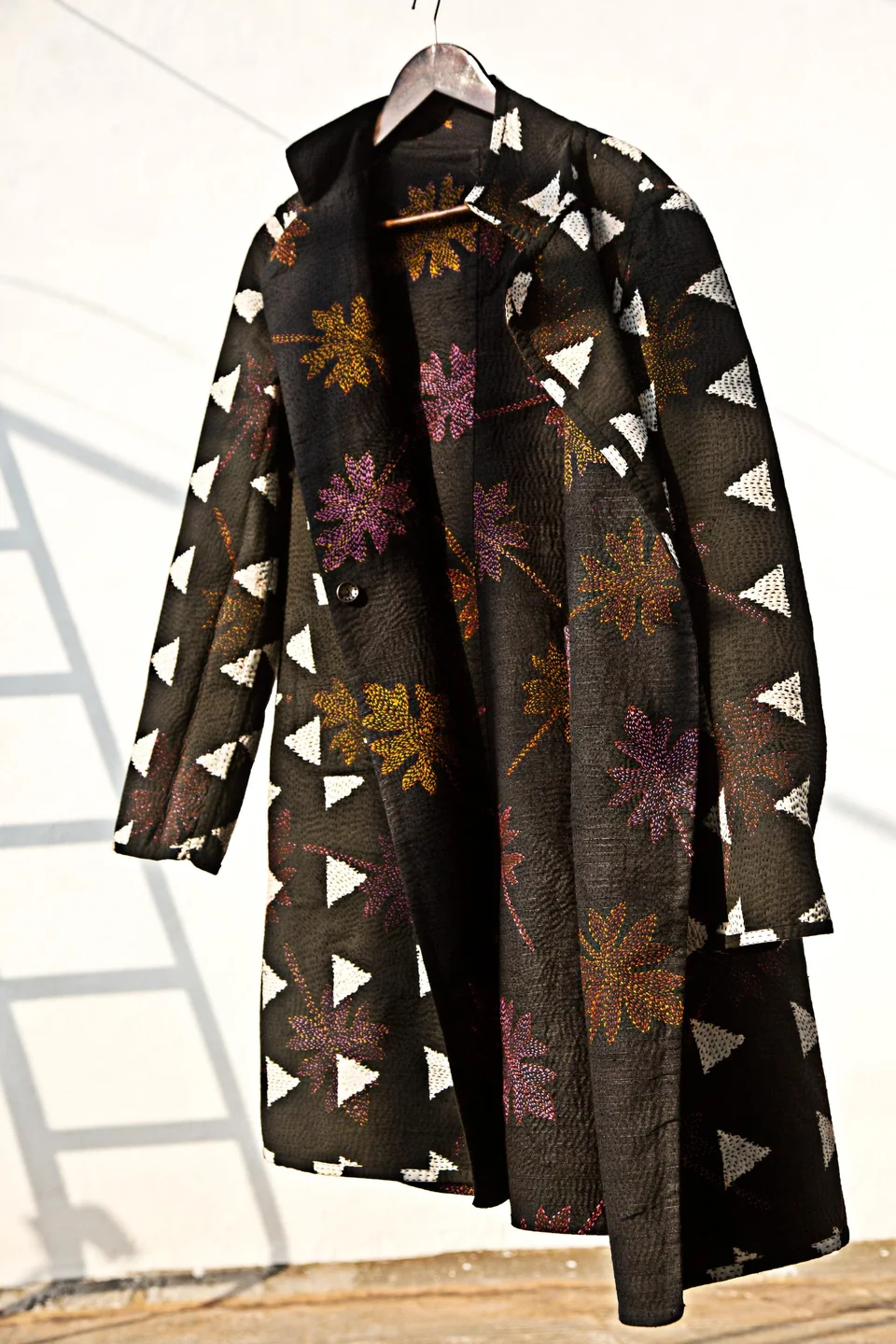 Long reversible coat with block-printed triangles and embroidered flowers