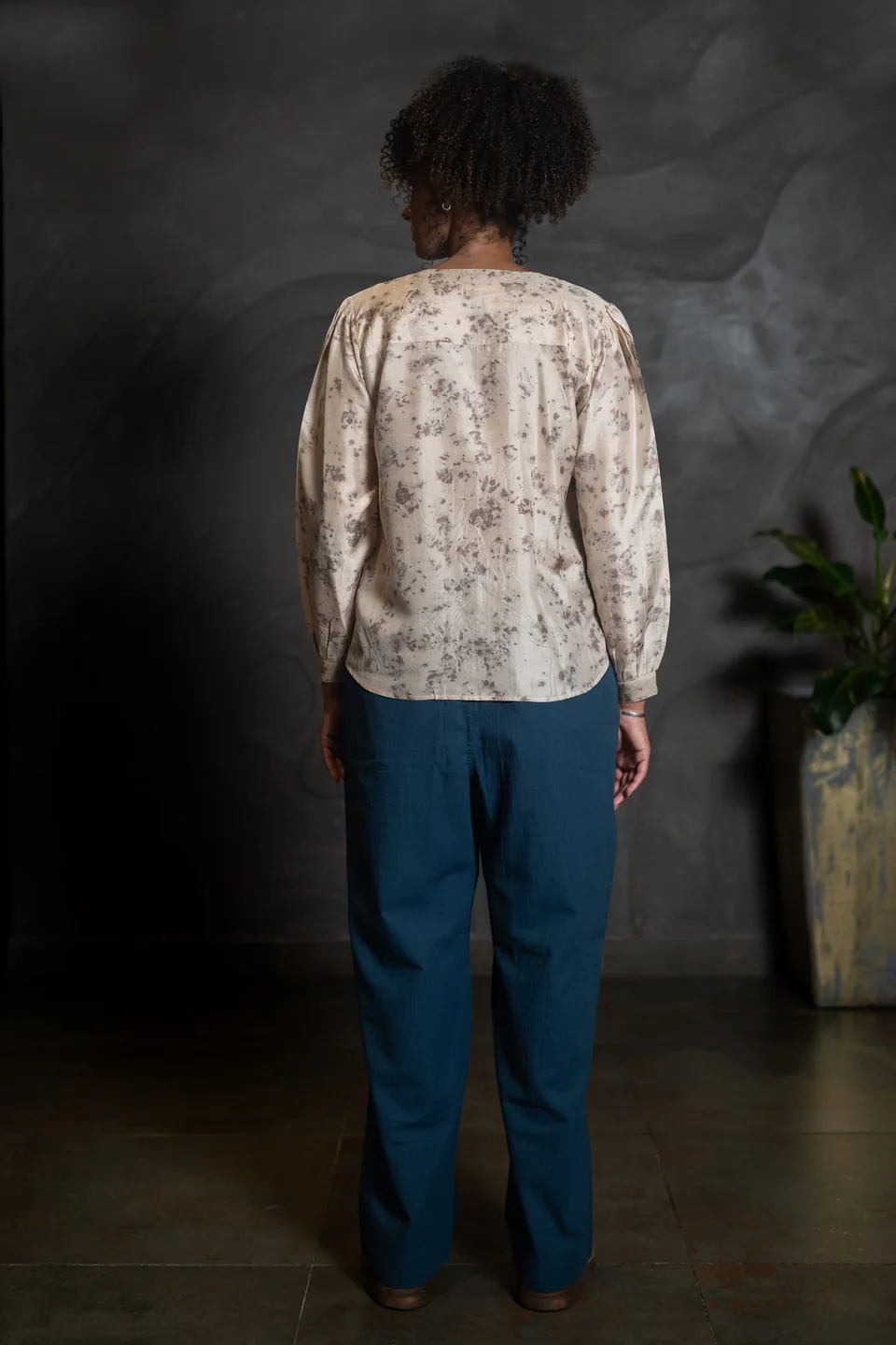 Back view of the eco-printed silk blouse, leaf marks scattered across the silk