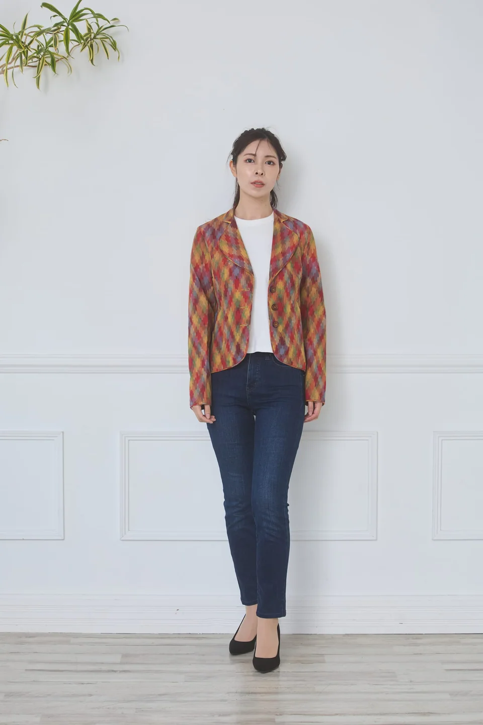 Walking towards the camera in the multicolour ikat jacket and heels