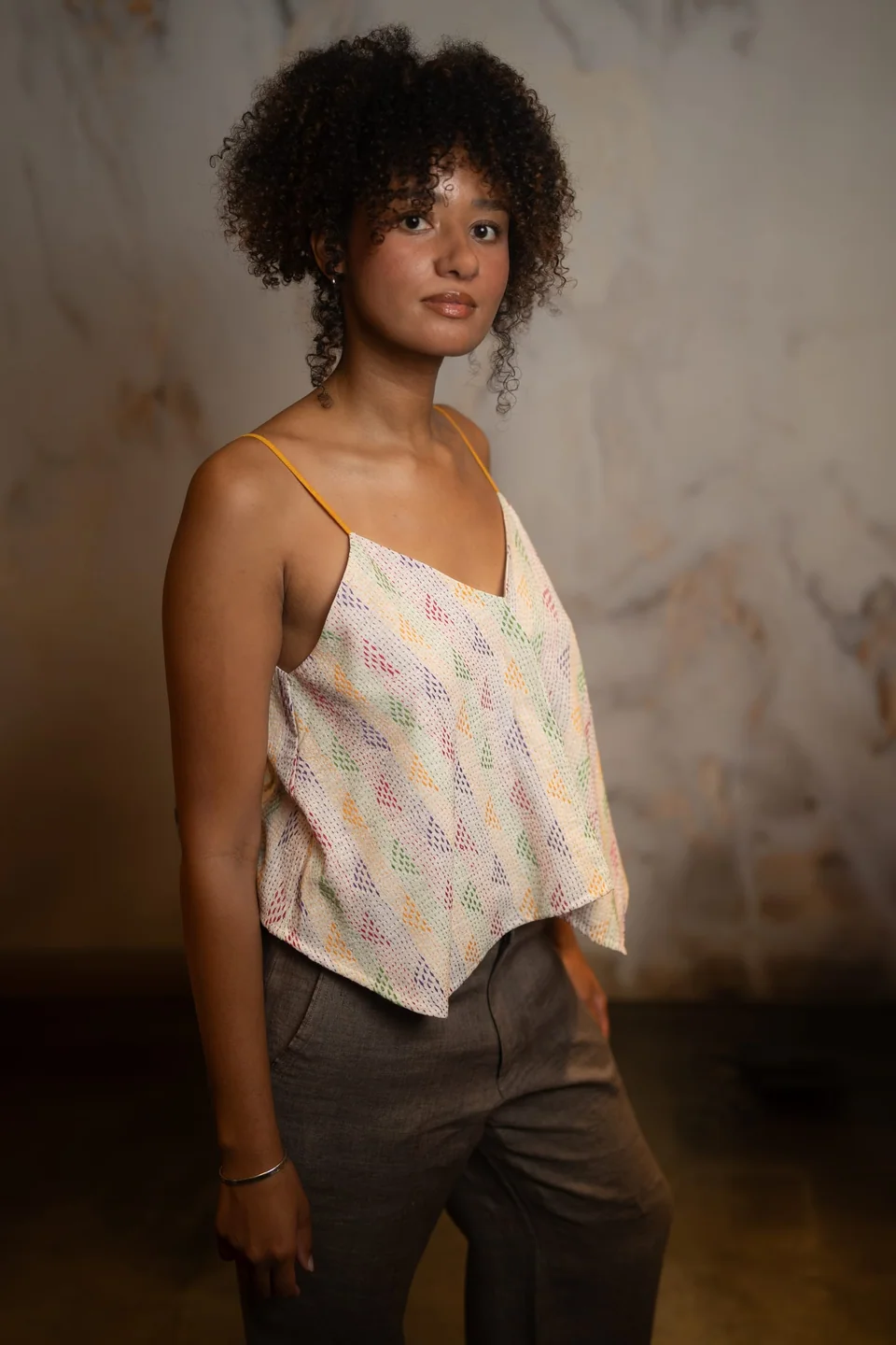 Cotton kantha cami with coloured running stitch worn with brown linen trousers