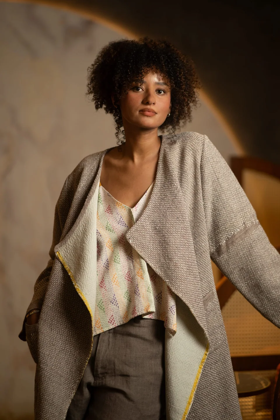 The cotton kantha cami layered under a grey handwoven wrap jacket