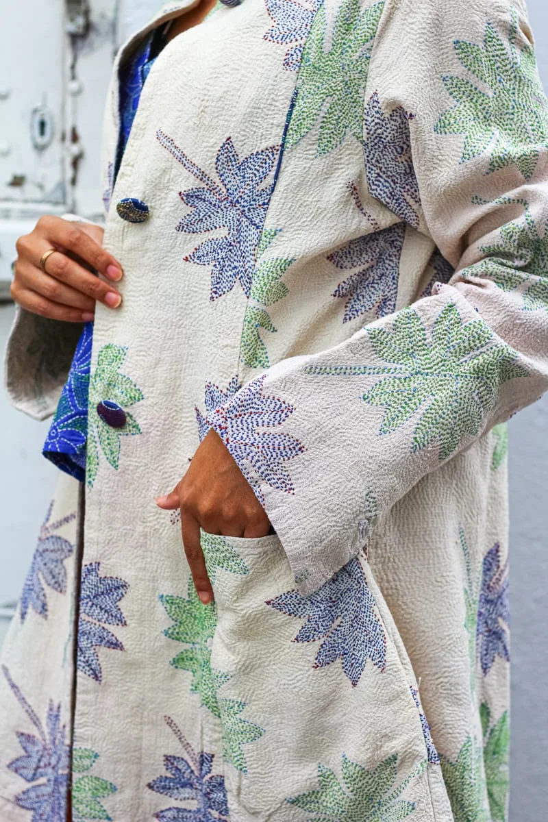 White coat worked with blue and green kantha leaves