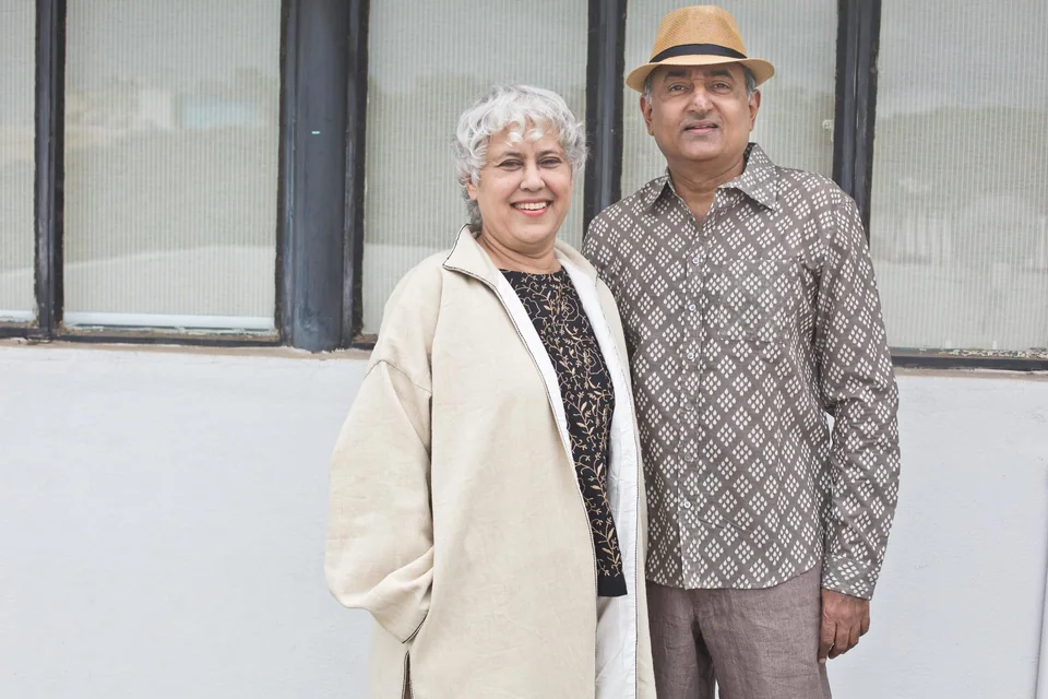 Manjula and Mahesh standing together outside the studio
