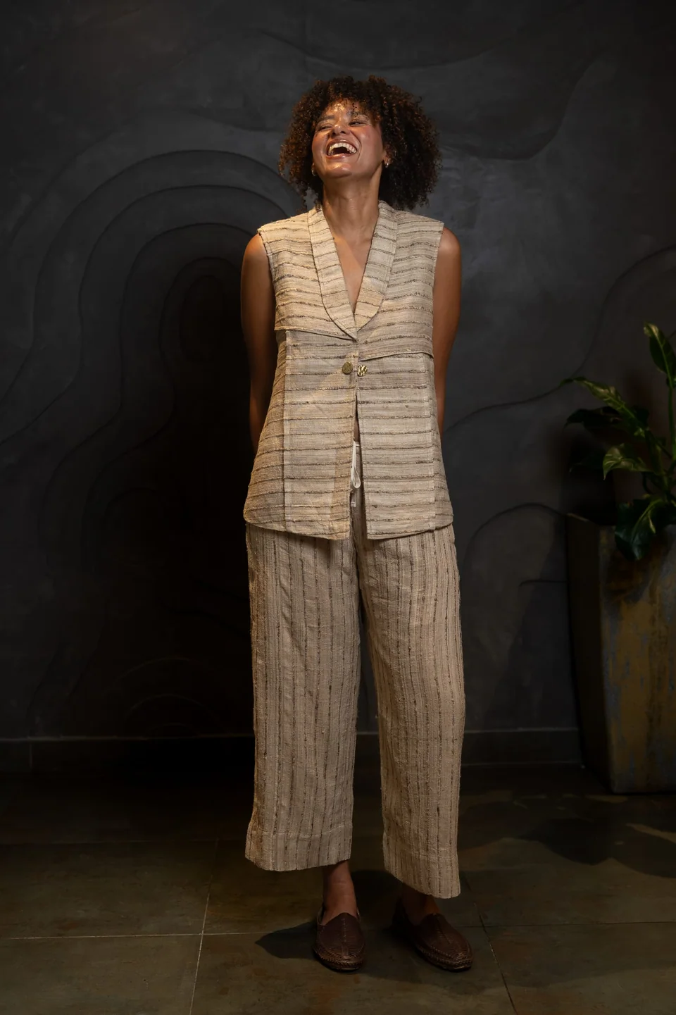 Full-length view of a tussar silk waistcoat worn over matching trousers